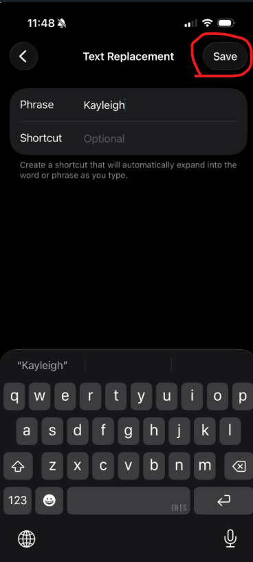 iPhone Text Replacement screen with the word Kayleigh typed in the Phrase field, Shortcut field left blank, and the Save button highlighted with a red circle