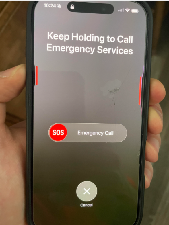 iPhone screen showing Emergency SOS mode with message “Keep Holding to Call Emergency Services”
