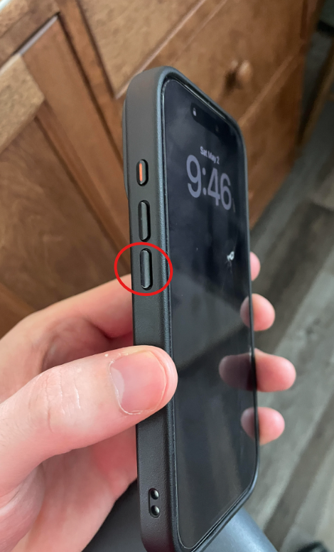 iPhone Volume Down button highlighted for force restart process